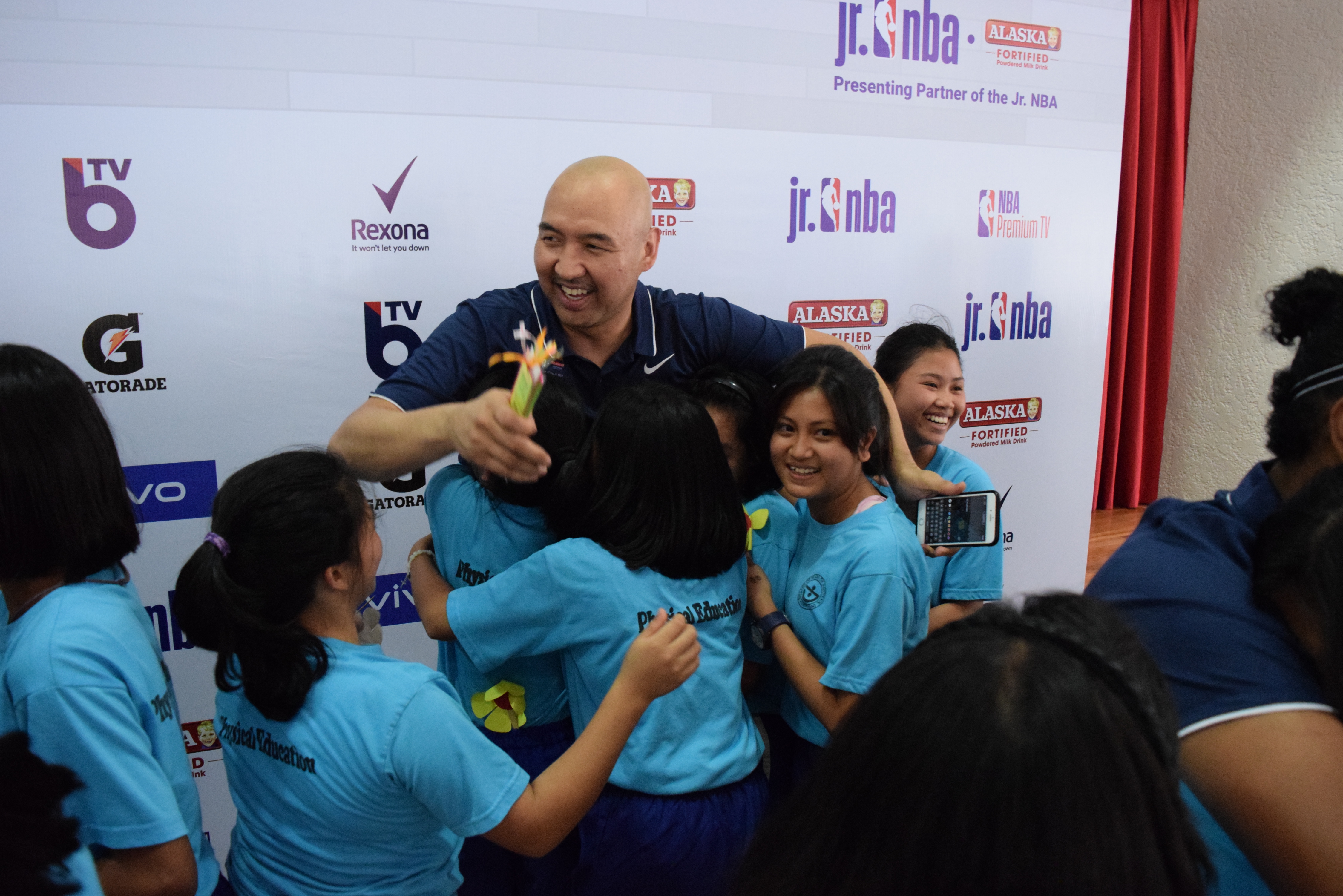 Jr NBA coaches Natalia Andrei Dos Santos, Jeffrey Cariaso get roses from Sisters of Mary Girls Town students in Cavite, Philippines